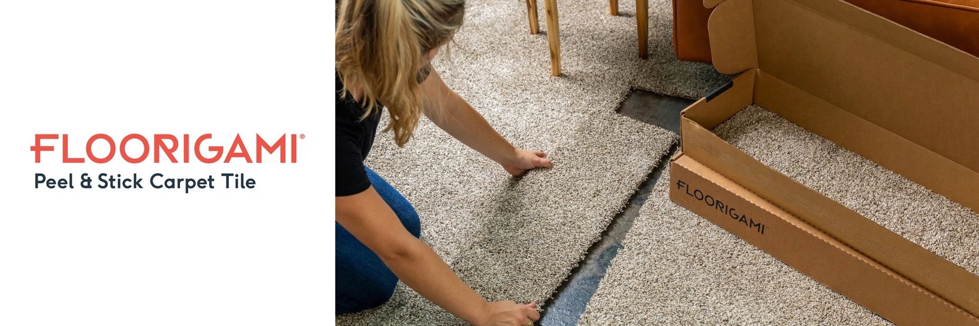 person installing carpet tiles from Anderson Tile & Carpet in Anderson, SC